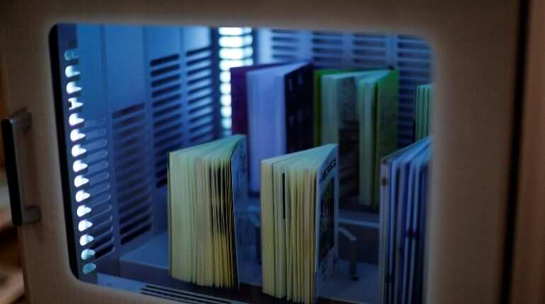 A ultraviolet sterilising machine cleaning library books, amid the coronavirus disease (COVID-19) outbreak, at Narimasu library in Itabashi district in Tokyo, Japan, December 9, 2020
