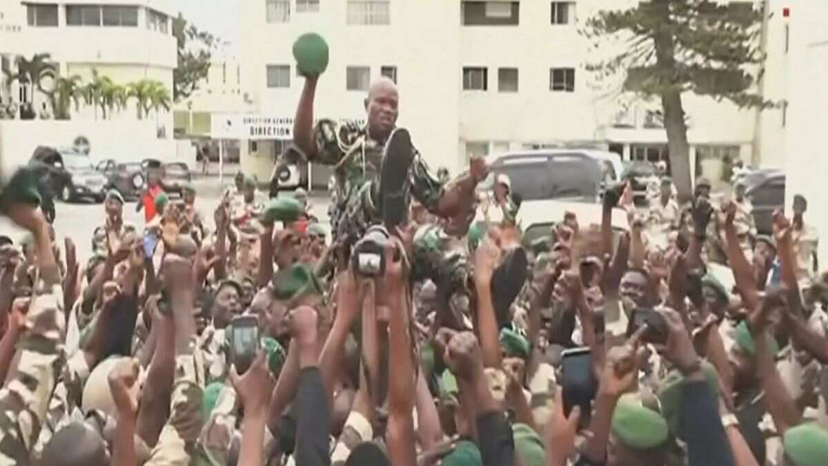 This video grab taken from Gabon 24 on August 30, 2023 shows Gabonese soldiers carrying General Brice Oligui Nguema (C), head of the preisdential guard of ousted President Ali Bongo Ondimba.