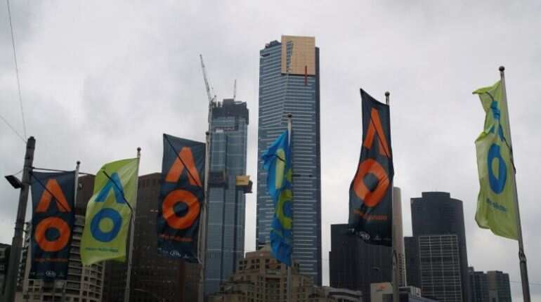 General view of flags in front of the Melbourne Skyline