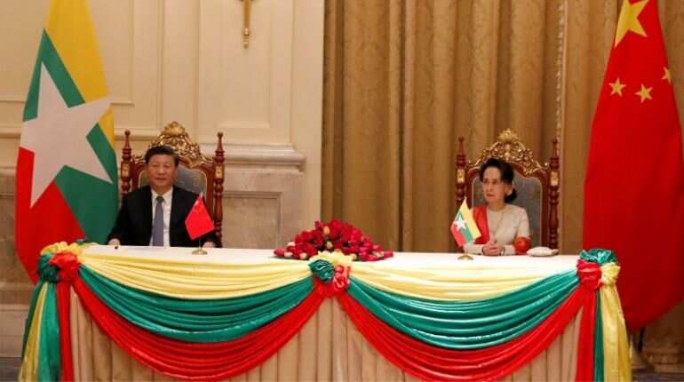 Chinese President Xi Jinping and Myanmar State Counselor Aung San Suu Kyi attend a signing ceremony of a memorandum of understanding (MOU)