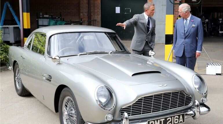 Daniel Craig shows off the Aston Martin