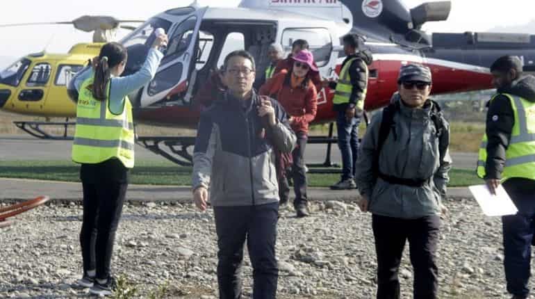 Trekkers arrive after a rescue operation from the Annapurna circuit