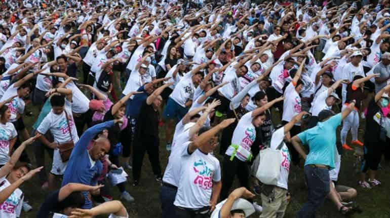 Runners warm up as they attend the "Run Against Dictatorship" event
