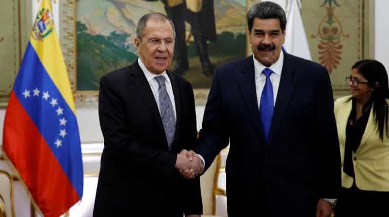 Venezuela's President Nicolas Maduro shakes hands with Russia's Foreign Minister Sergey Lavrov