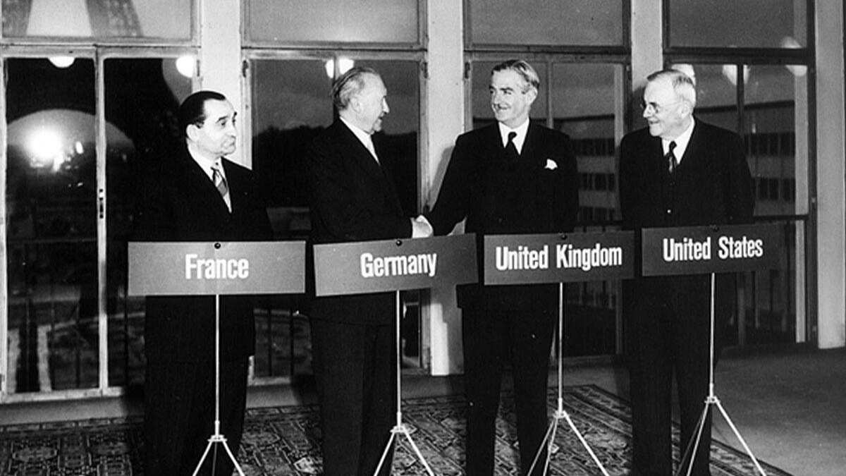French Premier and Foreign Secretary Pierre Mendès-France, West German Chancellor Konrad Adenauer, British Foreign Secretary Anthony Eden, and Secretary of State John Foster Dulles at Paris Conference, 23 October 1954.