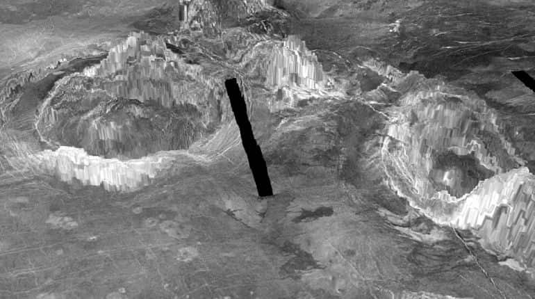 Two coronae, ring-like structures formed when hot material from deep inside the planet rises through the mantle and erupts through the crust, are observed on the surface of Venus in a 3-D rendition provided to Reuters July 20, 2020.