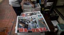 A newsstand sells copies of the Apple Daily newspaper (bottom) in Hong Kong on August 11, 2020, a day after authorities conducted a search of the newspaper's headquarters after the company's founder Jimmy Lai was arrested under the new national security law. 