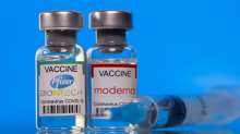 Vials with Pfizer-BioNTech and Moderna coronavirus disease (COVID-19) vaccine labels are seen in this illustration picture taken March 19, 2021