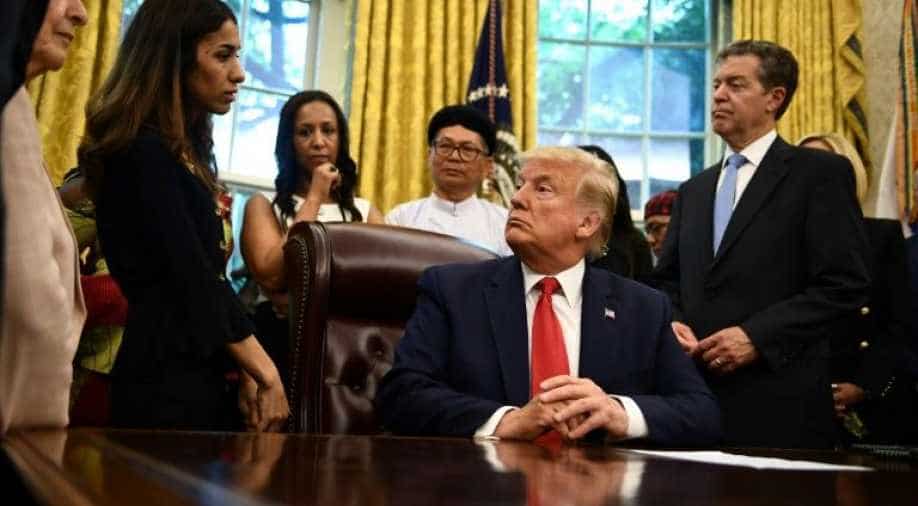 Awkward exchanges as Trump meets religious persecution survivors