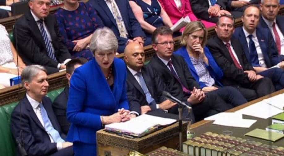 PM May fights back tears as she is applauded out of parliament