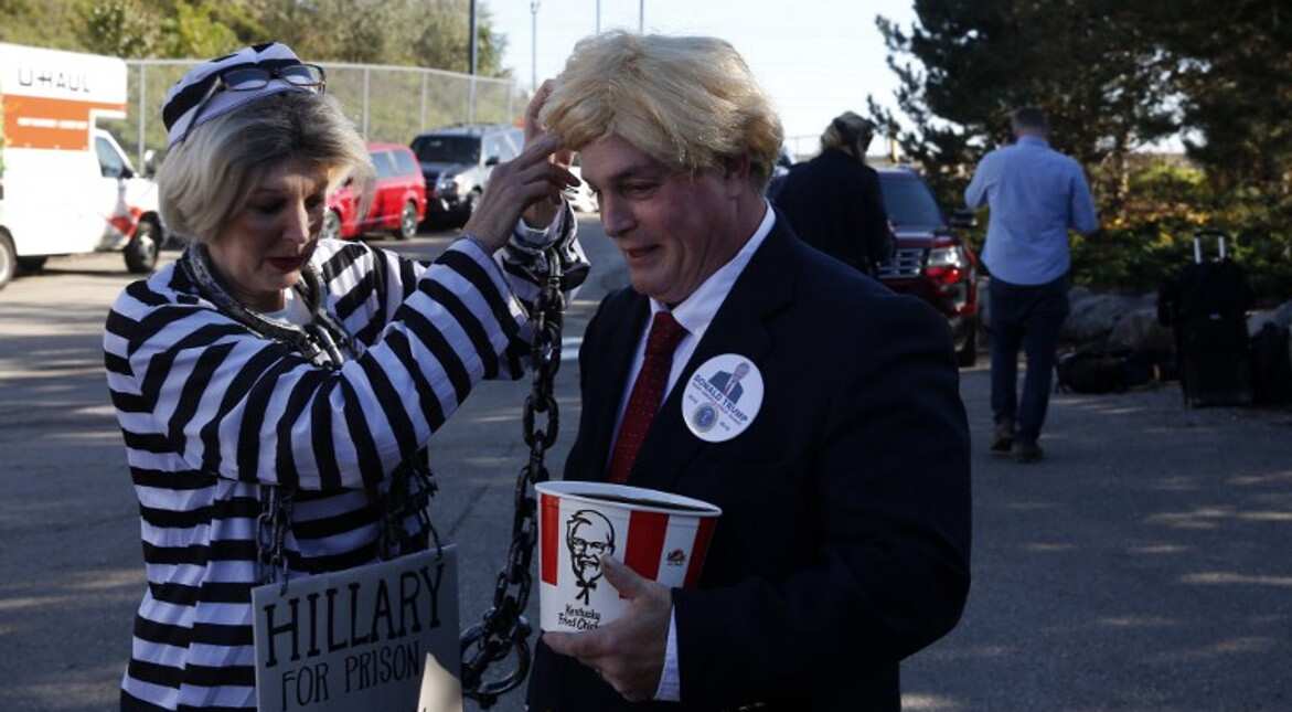 Musicians Alex Dee and Steve Perry wait for the Republican presidential nominee to address supporters at Sterling Heights, Michigan.