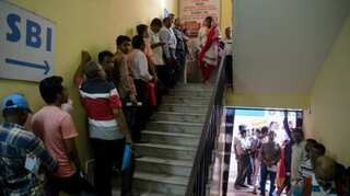 India: Chaos, long queues at banks; many ATMs still inactive