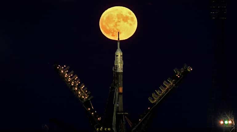 The supermoon is seen behind the Soyuz MS-03 spacecraft set on the launch pad at the Russian-leased Baikonur cosmodrome in Kazakhstan.