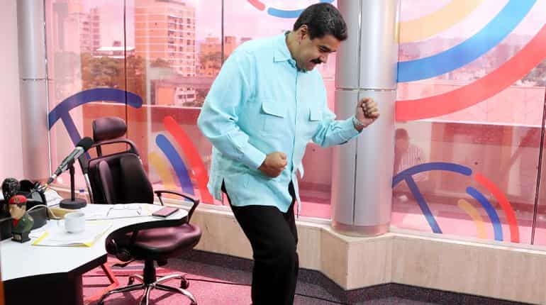 Photo released by the Venezuelan Presidency of Venezuelan President Nicolas Maduro dancing during a radio program in Caracas.