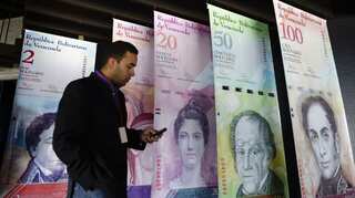 A million bolivars become one as Venezuela recalibrates battered currency