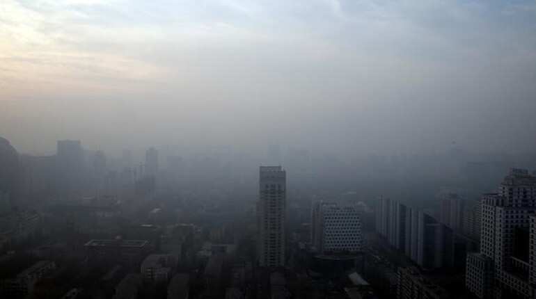 Under pollution alert, 1200 factories to shut or cut output in Beijing