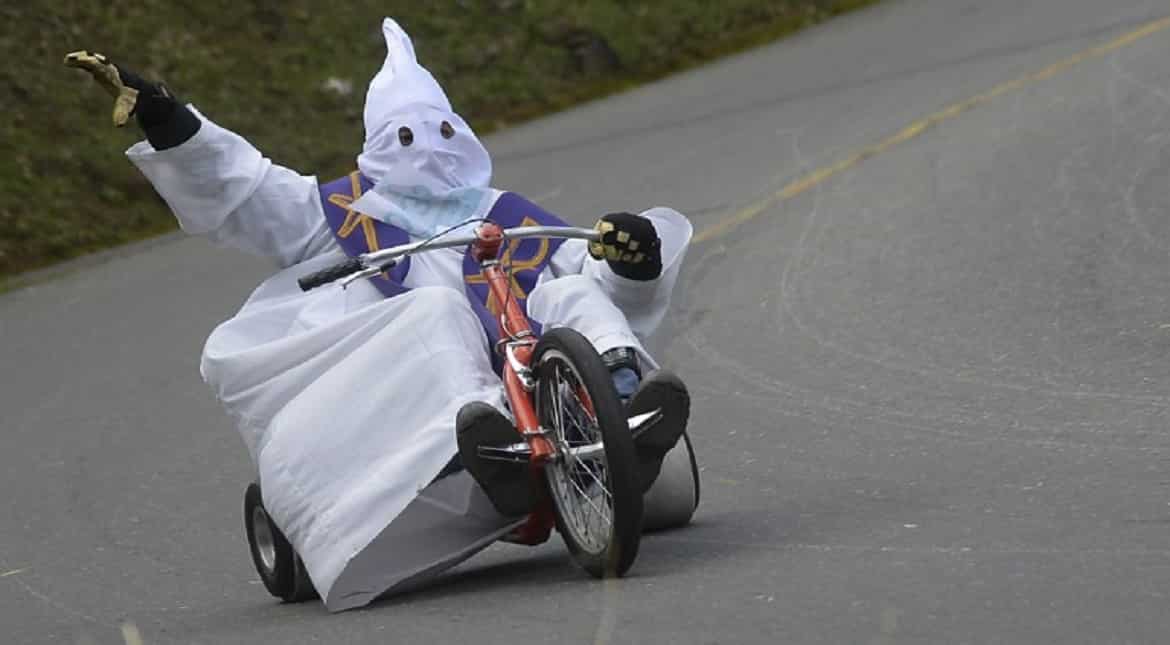 Participants fancy dressed go downhil in the XXVII Cart Festival in a homemade cart in the Santa Elena Municipality