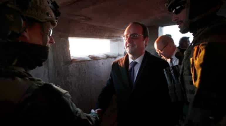French President Hollande meets Iraq's PM, vows to defeat IS