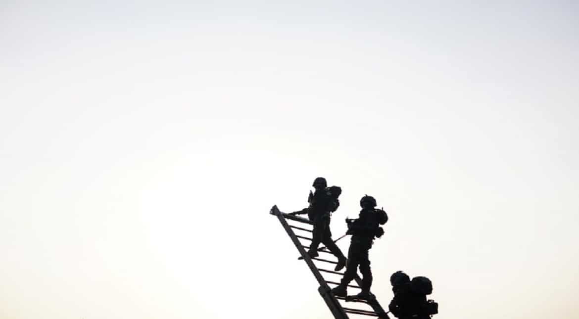 Indian National Security Guard commandos rehearse for the forthcoming Republic Day parade on Rajpath in New Delhi.