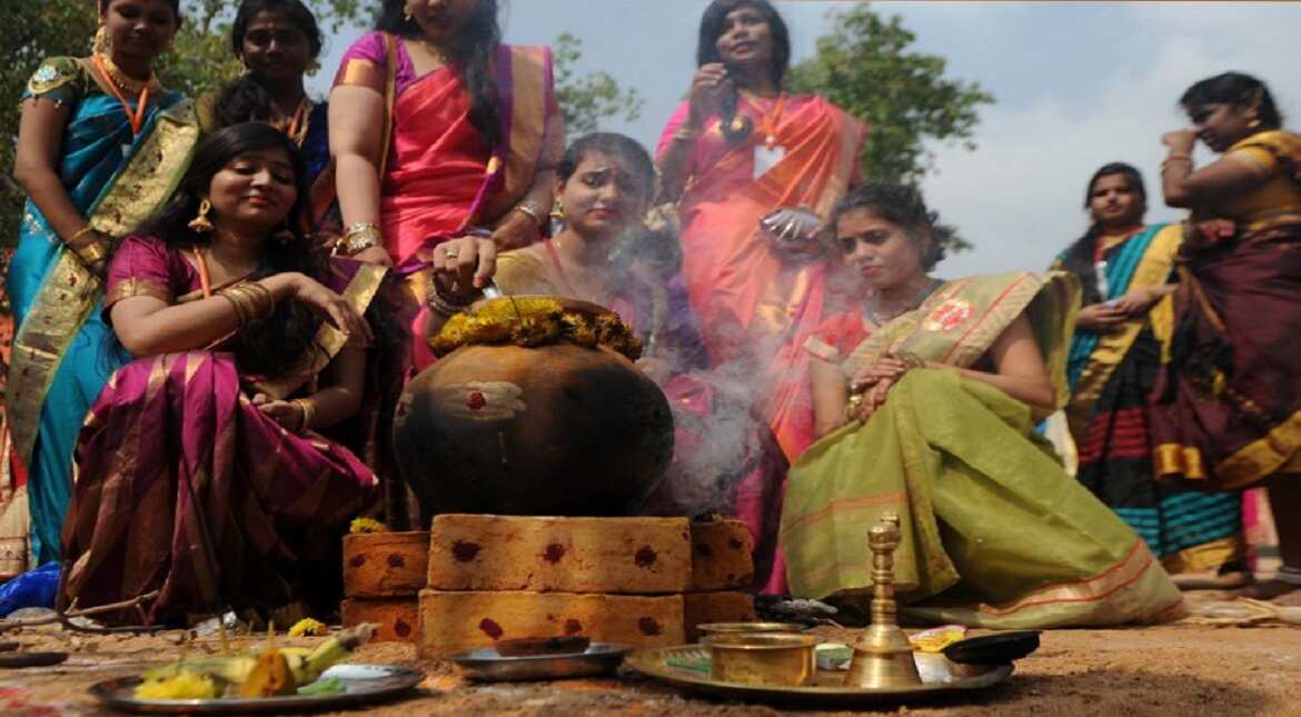 Indian women prepare Pongal during celebrations of the Tamil harvest festival, Pongal at a college in Chennai.
