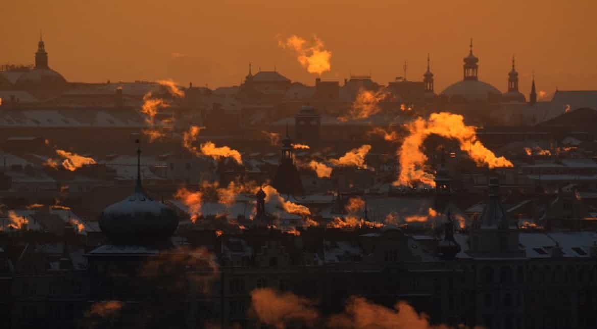 Smoke rises over the rooftops of central Prague as sun rises. The temperatures dropped to minus 17 degrees Celsius in the Czech capital.