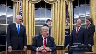 US President Donald Trump signs first executive order on Obamacare