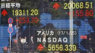 Tokyo's Nikkei closes above 30,000, first time since 1990