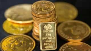 Gold ticks up as dollar stays under pressure ahead of Fed meeting