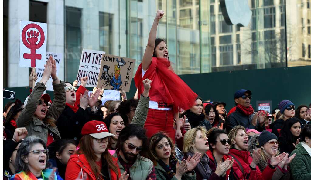 International Women's Day 2017: Thousands take part in anti-Trump protests