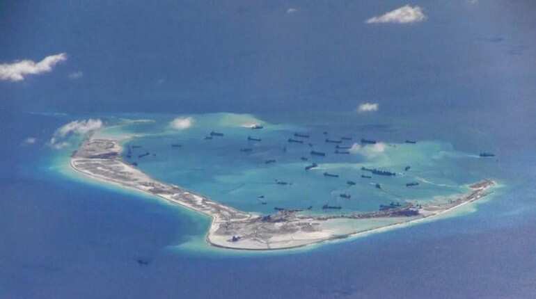 China begins fresh construction work on disputed South China Sea island