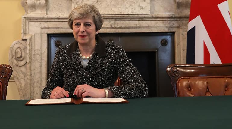 British PM Theresa May signs letter that will start Brexit