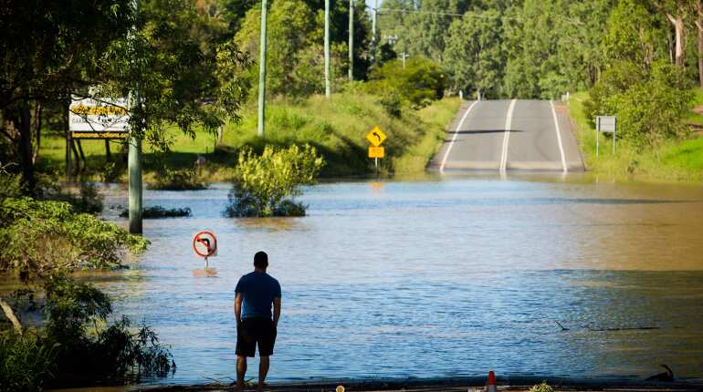 Floodwaters still rising in Australia, police search for missing