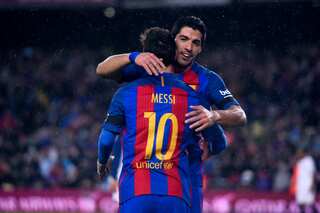 Messi's twin strikes, Suarez's screamer keep Barcelona's title hopes alive
