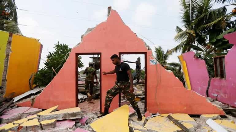 Hope fades for Sri Lanka missing, garbage dump collapse toll hits 21