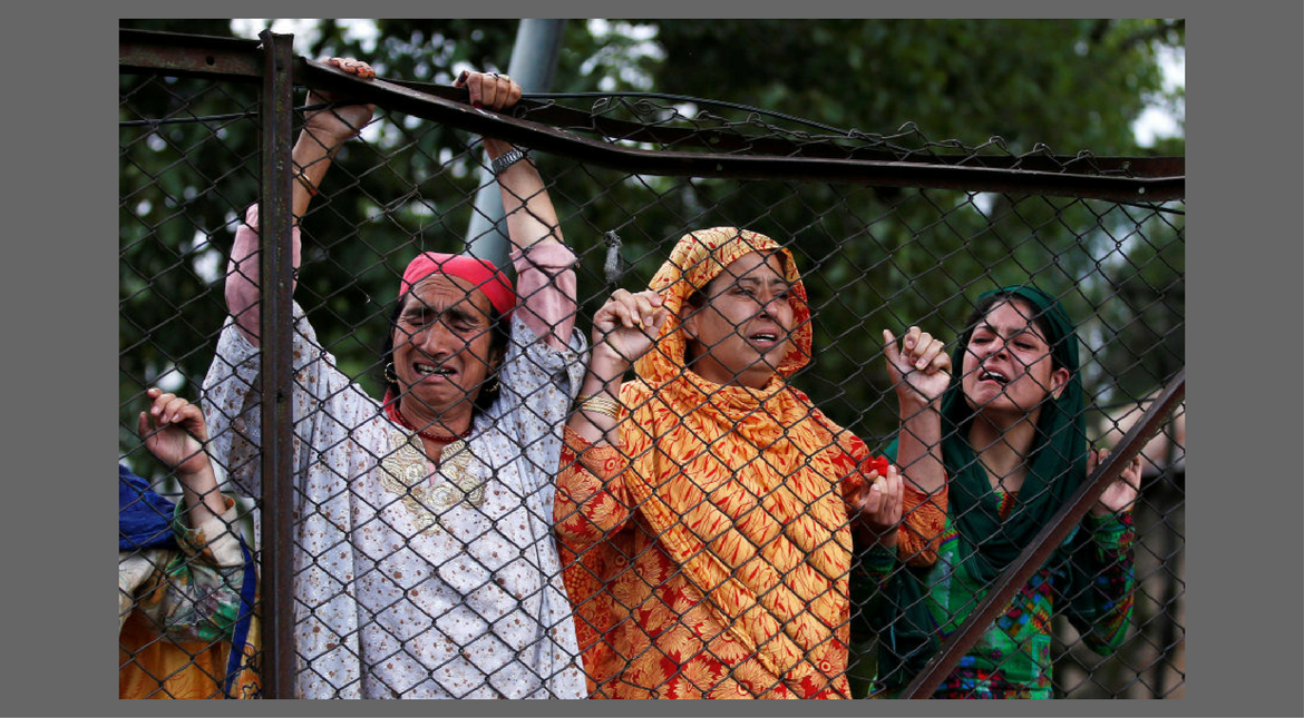 Women are seen mourning death of Burhan Wani