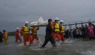 Desperate wait while bodies retrieved from Myanmar plane wreck