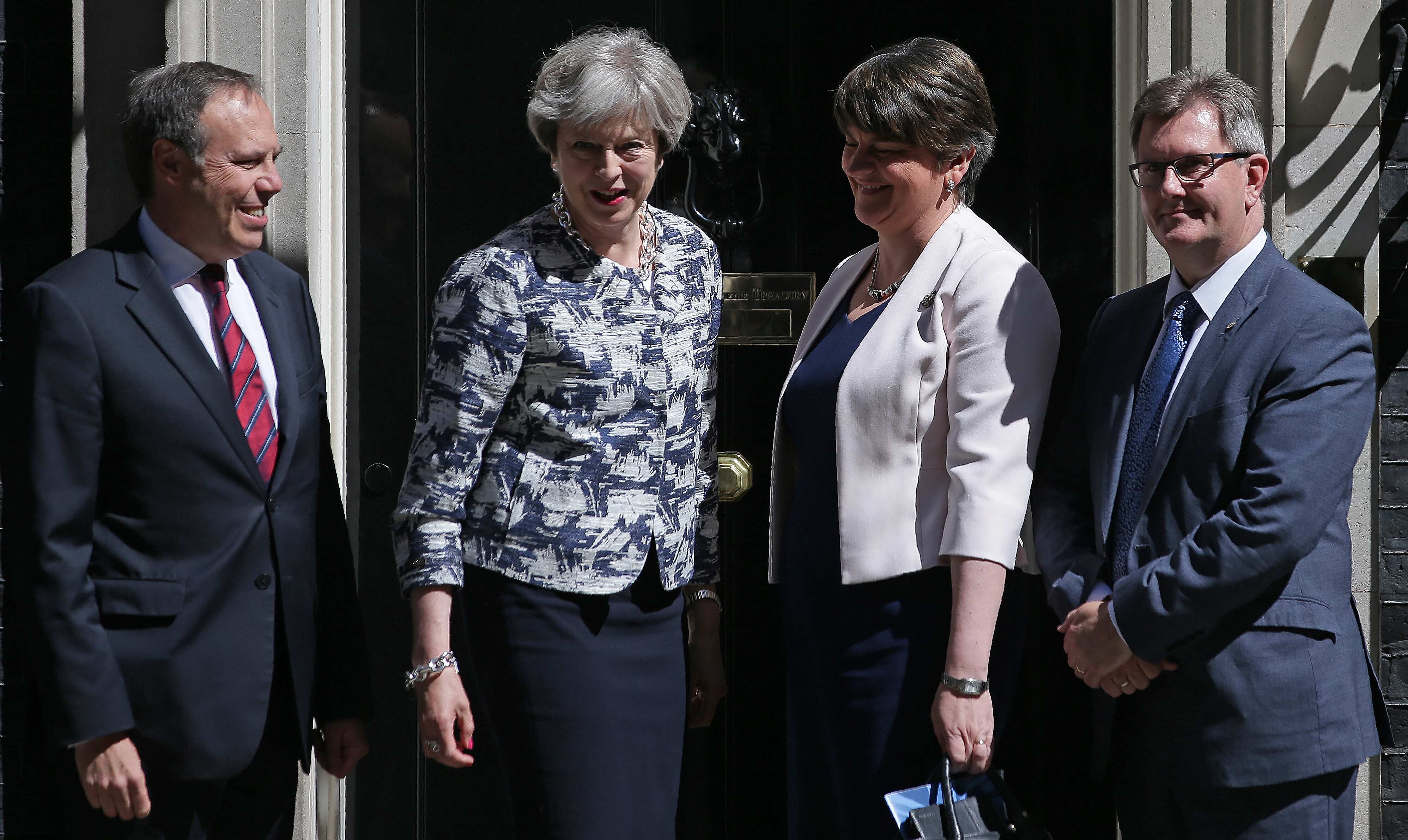 May's Conservatives, DUP prop up new government amid cash boost pledge