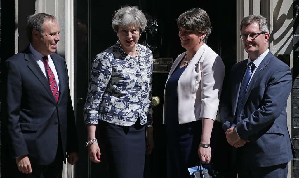 May's Conservatives, DUP prop up new government amid cash boost pledge