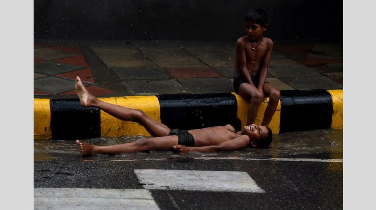 Children in Delhi enjoying the rain showers