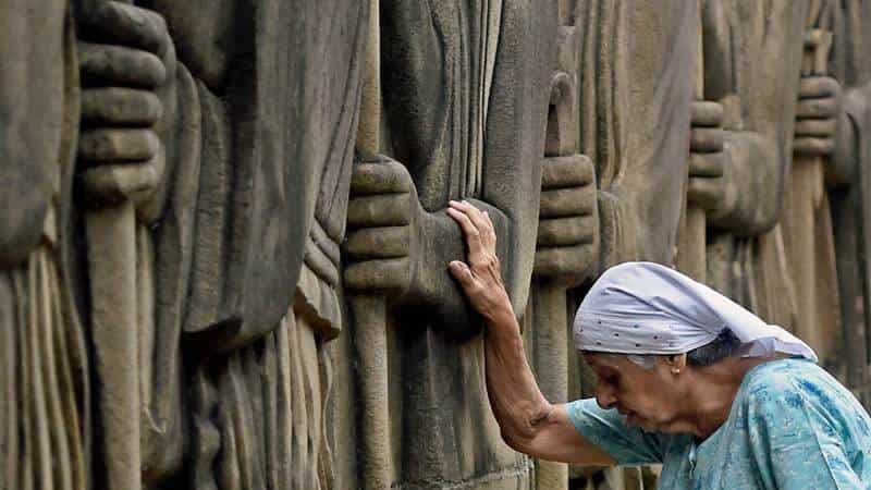 A Parsi woman takes a private moment to herself during the celebrations.
