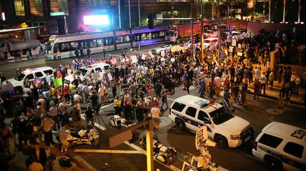 Trump's Phoenix rally pelted with rocks and bottles, Police used pepper spray to disperse protesters Trump's Phoenix rally pelted with rocks and bottles, Police used pepper spray to disperse protesters