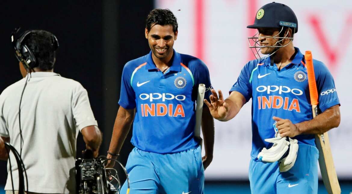 India's MS Dhoni and Bhuvneshwar Kumar chat after they won the match
