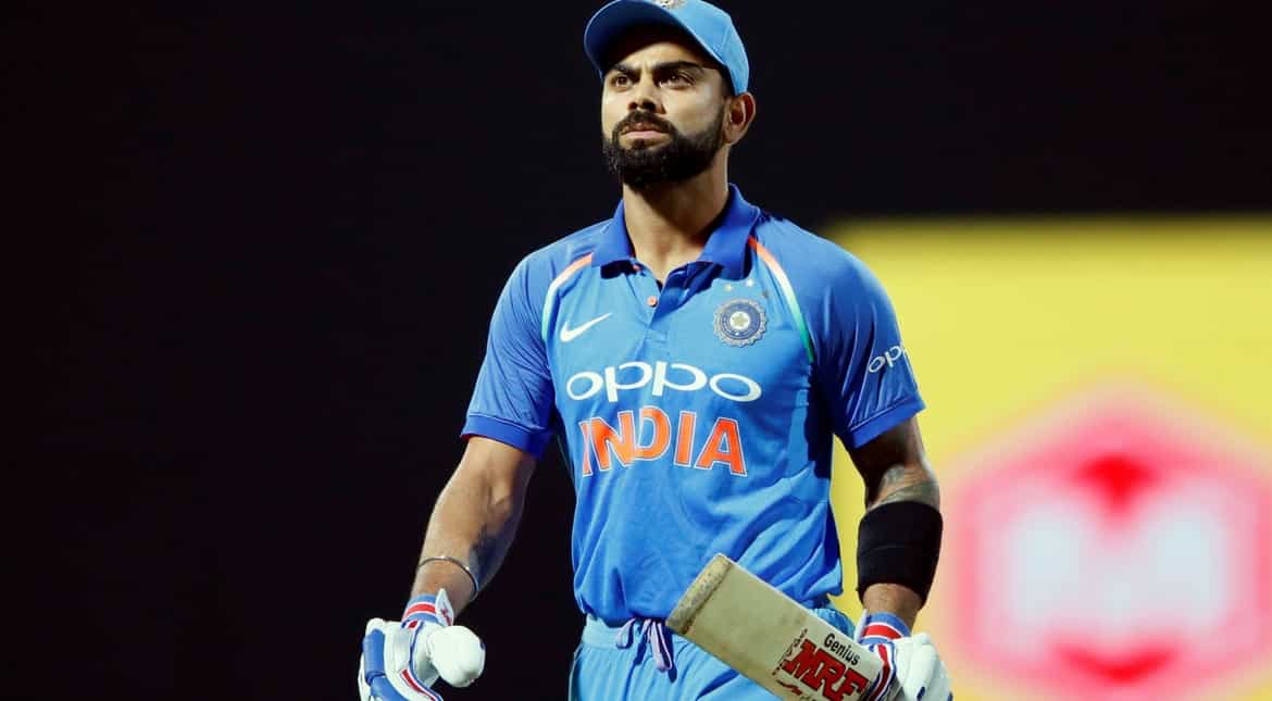 India's captain Virat Kohli walks off the field after his dismissal by Sri Lanka's Akila Dananjaya