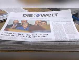 Weakened Angela Merkel wins fourth term, hit by nationalist 'earthquake'