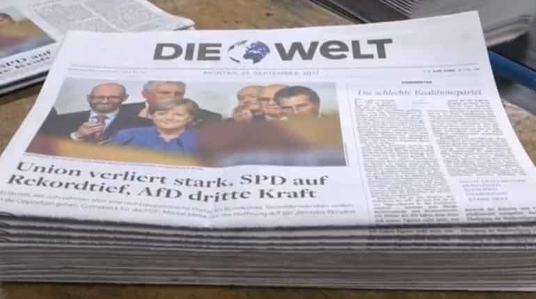 Weakened Angela Merkel wins fourth term, hit by nationalist 'earthquake'