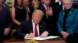 Frustrated by Congress, Trump signs order to weaken Obamacare