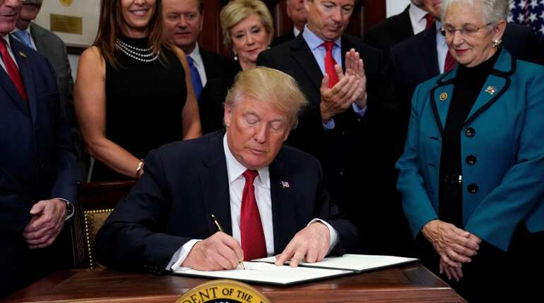 Frustrated by Congress, Trump signs order to weaken Obamacare