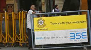 Sensex drops 100 points on muted earnings, profit booking