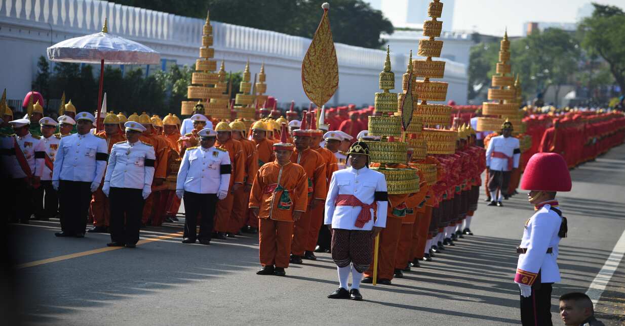 Attendants take part in the funeral procession