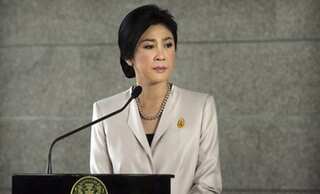 Thailand revokes passports of exiled former PM Yingluck